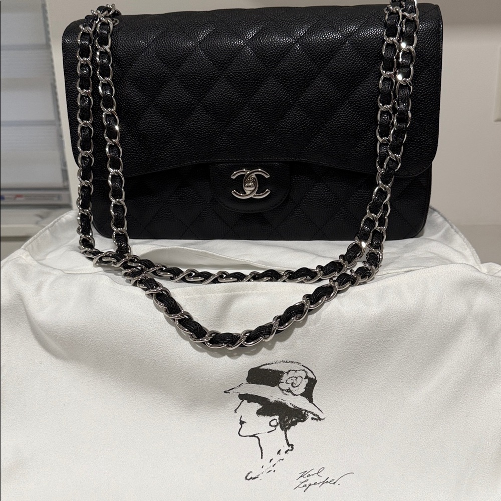 Chanel Black Caviar Quilted Shoulder Bag with Silver Chain. Double flap.